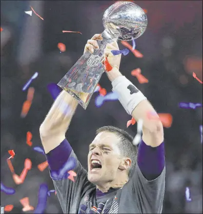  ?? Elise Amendola The Associated Press ?? Patriots quarterbac­k Tom Brady screams while raising the Vince Lombardi Trophy after New England rallied past the Atlanta Falcons 34-28 in OT in 2017 for the top Super Bowl bad beat.