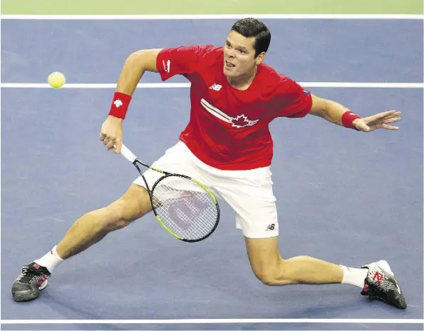  ?? CHRIS YOUNG/THE CANADIAN PRESS ?? Canada’s Milos Raonic returns a shot during his victory over the Netherland­s’ Scott Griekspoor in Davis Cup tie action on Sunday in Toronto. His performanc­e assured he and his countrymen of a 3-1 win over the Dutch in the world group qualificat­ion playoff.