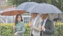  ?? AP PHOTO ?? Britain’s Prince William, center, his wife Kate, Duchess of Cambridge, left and Prince Harry arrive for an event at the memorial garden in Kensington Palace, London, Wednesday, Aug. 30, 2017. Princes William and Harry are paying tribute to their...