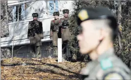  ?? Lee Jin-man ?? The Associated Press North Korean soldiers look at the spot in the Demilitari­zed Zone where a North Korean soldier crossed the border to defect on Nov. 13. The Clinton administra­tion came up with a war plan 23 years ago to deal with the North Korean...