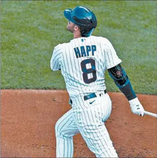  ?? CHRIS SWEDA/CHICAGO TRIBUNE ?? Ian Happ hits a solo homer in the first inning of Game 1 on Saturday against the Cardinals.