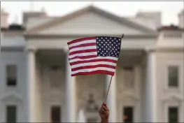  ?? CAROLYN KASTER — THE ASSOCIATED PRESS ?? In this September 2017 photo, a flag is waved outside the White House in Washington.