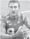  ?? WILFREDO LEE / AP ?? Miami Hurricanes punter Louis Hedley, of Australia, is the talk of Coral Gables with his size, swagger and tattoos.