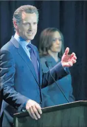  ?? Damian Dovarganes Associated Press ?? LT. GOV. Gavin Newsom speaks after being endorsed for governor by Sen. Kamala Harris, right.