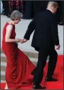  ?? AP/WILL OLIVER ?? President Donald Trump helps British Prime Minister Theresa May as they head Thursday into a black-tie dinner in Blenheim, England.