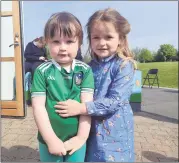  ?? (Pic: Marian Roche) ?? Little Lucy Cooke and Ellie Mae Tobin, who were at Scoil Fhionáin to see the new pitch officially opened.