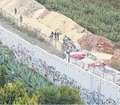  ?? REUTERS ?? Israeli soldiers patrol the border near the village of Kfar Kila in Lebanon.