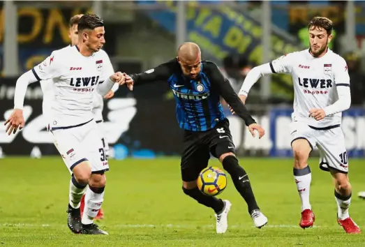  ??  ?? Cornered: Inter Milan’s Rafinha trying to get past Crotone players in the Serie A match at San Siro on Feb 3. —AP