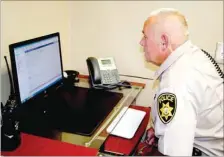  ?? PAT HARRIS ENTERPRISE-LEADER ?? Lincoln Police Officer Greg Gunn sits at one of the new computers at the Police Department’s new headquarte­rs, located on the west side of the facility housing the Lincoln Water Department. Gunn said the new offices were just “perfect.”