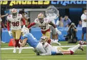  ?? JAE C. HONG — THE ASSOCIATED PRESS ?? Chargers quarterbac­k Easton Stick (2) is tackled by 49ers defensive end Arik Armstead during the first half of their preseason game on Sunday in Inglewood.