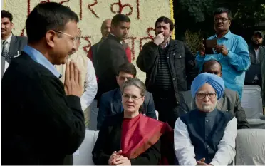  ?? PTI ?? Delhi chief minister Arvind Kejriwal exchanges greetings with Congress president Sonia Gandhi and former Prime Minister Manmohan Singh at a function in New Delhi on Monday.