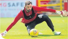  ??  ?? Aberdeen keeper Joe Lewis