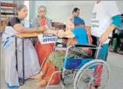  ?? AP ?? A polling officer puts the indelible ink mark on the finger of a specially-abled woman voter in Hyderabad, on Friday.