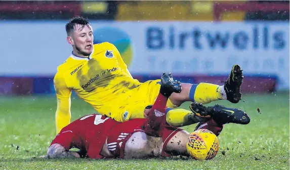  ?? Picture: Robbie Stephenson/JMP ?? Bristol Rovers midfielder Ollie Clarke is fouled by Accrington striker Billy Kee in Saturday’s game at the Wham Stadium