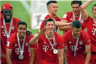  ??  ?? Sarpreet Singh, second from left, celebrates with his Bayern Munich teammates.