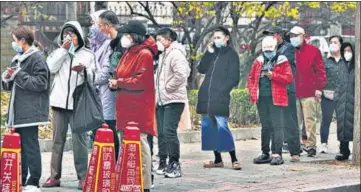  ?? AP ?? Residents line up for Covid tests in Beijing, China on Thursday.