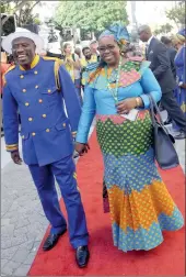  ?? PICTURE: CINDY WAXA ?? COLOUR-CODED: ANC MP Dumisani Ximbi and his wife Ntombethem­ba cut colourful figures on the red carpet ahead of the president’s address.