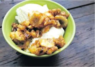  ?? PHOTO: DAN CLAPSON/ FOR POSTMEDIA WORKS ?? Bananas are transforme­d when combined with caramel and a little brandy, then heated up on the barbecue. Served over ice cream, they make a perfect sundae topping.