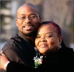  ?? Photo contribute­d by Brian Mogren ?? Mary Johnson-Roy (right) hugs Oshea Israel. The two developed a bond 10 years into his 25-year prison sentence for the murder of her 20-year-old son.