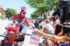  ??  ?? A man dressed as a clown greets onlookers at the ‘Pow Wow Days Parade’ during Independen­ce Day celebratio­ns in Tomahawk, Wisconsin, US. — Reuters photo