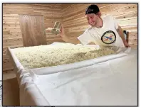  ?? (Special to the Democrat-Gazette) ?? Justin Potts, director of brewing relations, inoculates rice at Origami Sake Brewery in Hot Springs.