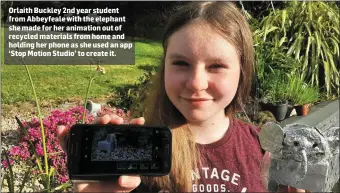  ??  ?? Orlaith Buckley 2nd year student from Abbeyfeale with the elephant she made for her animation out of recycled materials from home and holding her phone as she used an app ‘Stop Motion Studio’ to create it.