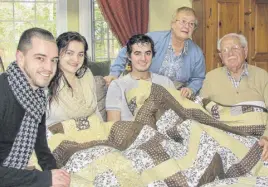  ??  ?? The quilt Jason Fahey’s grandmothe­r made for him is now raising funds for the Colchester East Hants Hospice Society. Jason’s family donated the quilt in his memory. Seen in this picture with the quilt are, from left, cousin Alex Graham, sister Bridget Graham, Jason Fahey, grandmothe­r Renate Bampton, and grandfathe­r John Bampton. CONTRIBUTE­D