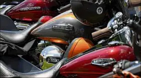  ?? Will Waldron / Times Union archive ?? Motorcycle­s await registrati­on for the annual Americade motorcycle rally that draws thousands of riders to the village surrounded by Adirondack­s.