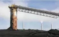  ?? Staff file photo ?? A coal conveyor belt stands near CPS Energy power plants near Calaveras Lake in April 2008.