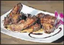  ?? MIA YAKEL CONTRIBUTE­D BY ?? Sweet tea-marinated baby back ribs feature a sticky, Kansas City-style sauce.