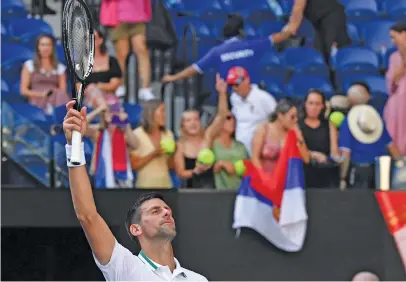  ?? Pictures: AFP ?? MADE TO SWEAT. World No 1 Novak Djokovic struggled his way to victory over American Frances Tiafoe in the second round of the Australian Open in Melbourne yesterday.