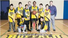  ??  ?? The Sacred Heart Buffalo boys basketball team poses with its championsh­ip trophy in the school’s new gymnasium. Front row on knees: John Nepomuceno, left, and Nguyen Cao. Standing, from left: Frankie Clampitt, Dettrius La Rose, Jomel Bacor, Victoire...