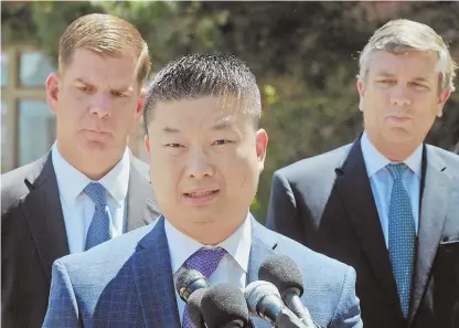  ?? STAFF PHOTO BY PATRICK WHITTEMORE ?? TAKING THE LEAD: Boston Public Schools chief Tommy Chang speaks to reporters yesterday as Boston Mayor Martin J. Walsh, left, and BPS Chairman Michael D. O’Neill, look on.