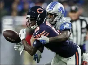  ?? REY DEL RIO — THE ASSOCIATED PRESS ?? Detroit Lions cornerback Nevin Lawson (24) deflects a pass intended for Chicago Bears wide receiver Kendall Wright (13) during the second half of an NFL football game, Saturday in Detroit.