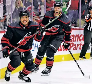  ?? Getty Images ?? TO THE MAX! Max Domi celebrates alongside Jordan Staal after the first of his two goals during the second period helped the Hurricanes eliminate Boston.