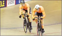  ??  ?? Netherland­s’ Jeffrey Hoogland (right), beats Netherland­s’ Harrie Lavreysen in race two of the men’s sprint race semifinal of the track cycling at the Sir Chris Hoy Velodrome during the 2018 European Championsh­ips in Glasgow on Aug 6. (AFP)
