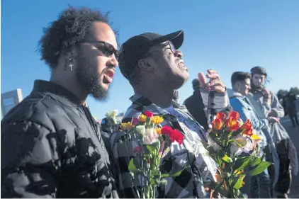  ?? AFP ?? A man cries as he stands next to his partner while paying their respects to the victims of the mass shooting at Club Q in Colorado Springs on Sunday.