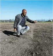  ?? Pictures: WERNER HILLS ?? WHERE’S THE GRASS? Zwide Football Associatio­n chair Marks Totwana on the field at the Motuna-Shining Stars Ground in Daku yesterday