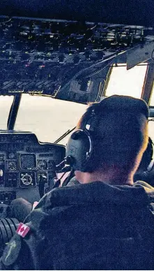  ??  ?? Inside the cockpit of a CC-130 Hercules