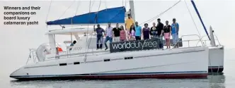  ??  ?? Winners and their companions on board luxury catamaran yacht