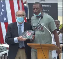  ?? MEDIANEWS GROUP FILE PHOTO ?? Delaware County Veterans Memorial Founding member Claude de Botton was presented with a designed artwork for placement at the memorial by JACE organizer Richard Blye at the 2020Junete­enth Celebratio­n.