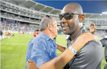  ?? FILE ?? Mount Pleasant assistant coach, Davion Ferguson (right), and owner Peter Gould embrace after winning the Jamaica Premier League final last season.