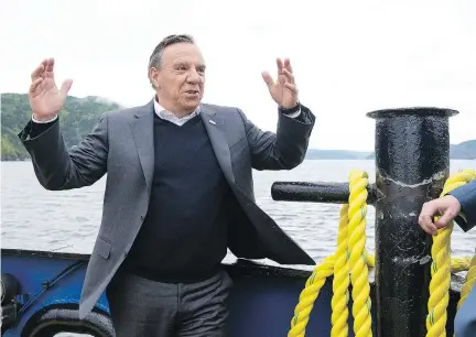  ?? JACQUES BOISSINOT/THE CANADIAN PRESS ?? CAQ Leader François Legault crosses the Saguenay River in Tadoussac on Wednesday. Legault faced questions over an audio recording of comments made by his wife, Isabelle Brais, during a pre-campaign event in Westmount in August.
