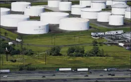  ?? MARK LENNIHAN — THE ASSOCIATED PRESS ?? Traffic passes oil storage tanks owned by the Colonial Pipeline Co. in Linden, N.J., in 2008. Colonial Pipeline, a major pipeline that transports fuels along the East Coast, said it had to stop operations Friday because it was the victim of a cyberattac­k.