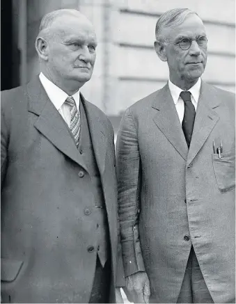  ?? NATIONAL PHOTO COMPANY/WIKIMEDIA COMMONS ?? Rep. Willis Hawley, left, and Sen. Reed Smoot after the Smoot-Hawley Tariff Act was signed. The act is believed to have worsened the Great Depression in the 1930s.