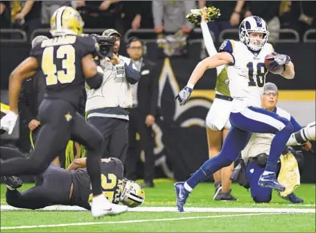  ?? Wally Skalij Los Angeles Times ?? COOPER KUPP, back after missing two games with a knee injury, scores a tying touchdown in the fourth quarter at New Orleans.
