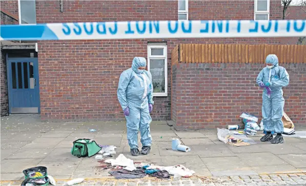  ??  ?? Police forensics teams work at the scene of one of the four stabbings in Edmonton, north London, at the weekend