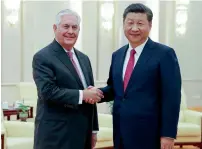  ?? AP ?? Rex Tillerson with China’s President Xi Jinping before their meeting at the Great Hall of the People on Saturday in Beijing, China. —