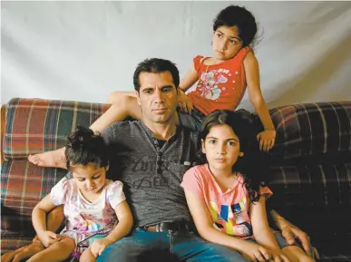  ??  ?? Sadoullah Malakooti with his daughters.