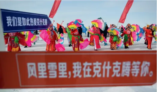  ?? ?? People perform on Dalinor Lake in Chifeng City, Inner Mongolia Autonomous Region, on January 13, at the launch of a promotiona­l event for tourism and ice fishing
